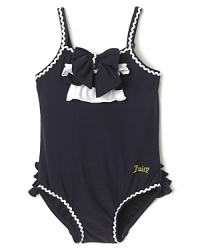 This chic Juicy Couture swim suit charms with bright white rick rack trim and flouncy ruffles on the chest and tush. This chic Juicy Couture swim suit charms with bright white rick rack trim and flouncy ruffles on the chest and tush.