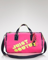 Glam to-go. Juicy Couture makes a bold statement with patent leather handles, neon lining and signature charms dangling from a multicolor chain. Glam to-go. Juicy Couture makes a bold statement with patent leather handles, neon lining and signature charms dangling from a multicolor chain.