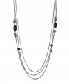 Long story. From the Crystal Elegance Collection, T Tahari's triple strand long necklace features subtle embellishment in the form of red and black crystal accents. Crafted in hematite tone mixed metal, it's nickel free for sensitive skin. Approximate length: 30 inches + 3-inch extender.