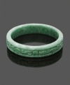 For a look as unique as you. This carefully-crafted and carved bangle features an intricate scrolling pattern made entirely of beautiful green jade. Bangle slips over the wrist. Approximate diameter: 3 inches.