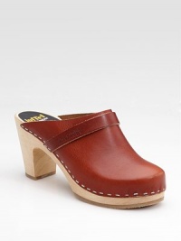 Beautiful rich leather with matching strap and staple detail for contrast.Wooden heel, 3 (75mm) Wooden platform, ½ (15mm) Compares to a 2½ heel (65mm) Round toe Leather lining Rubber sole Made in SwedenOUR FIT MODEL RECOMMENDS ordering true whole size; ½ sizes should order the next whole size up. Beautiful rich leather with matching strap and staple detail for contrast.Wooden heel, 3 (75mm) Wooden platform, ½ (15mm) Compares to a 2½ heel (65mm) Round toe Leather lining Rubber sole Made in SwedenOUR FIT MODEL RECOMMENDS ordering true whole size; ½ sizes should order the next whole size up.