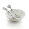 Nature-inspired, this striking bowl and server set features a smattering of leaves recalling a forest's floor.