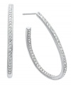 Sparkle from every angle. Eliot Danori's dazzling hoop earrings feature round-cut crystals lining the inside and outside of a chic, J hoop design. Set in silver tone mixed metal. Approximate diameter: 7/8 inch.