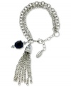 Worth the tassel. Silver stands out in this link bracelet from T Tahari. Crafted of silver-tone, nickel-free mixed metal, the bracelet features a tassel pendant and black accents. Approximate length: 7-1/2 inches + 3-inch extender. Approximate drop: 4-1/4 inches.