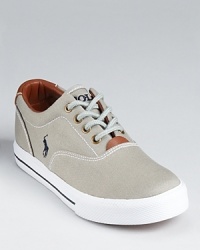 The classic preppy low-top rendered in canvas with leather lining and trim. The classic preppy low-top rendered in canvas with leather lining and trim.