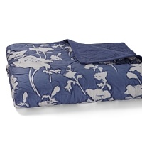 Bright white flowers stand out against a vivid blue field in this quilt by kate spade new york. Each flower's border is stitched; quilt reverses to solid blue with stitching. Bright white flowers stand out against a vivid blue field in this quilt by kate spade new york. Each flower's border is stitched; quilt reverses to solid blue with stitching.