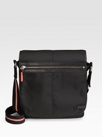 A classic bag made for every move you make with enduring nylon construction. Zip closure Leather trim Adjustable shoulder strap Exterior, interior zip pockets Signature lining 12½W X 12½H X 4D Nylon Made in Switzerland A classic bag made for every move you make with enduring nylon construction. Zip closure Leather trim Adjustable shoulder strap Exterior, interior zip pockets Signature lining 12½W X 12½H X 4D Nylon Made in Switzerland