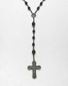 A simple, yet masculine addition to your ensemble, with a strand black onyx beads complemented by a sterling silver cross pendant.Sterling silverBlack onyxAbout 37, inner diam.About 7 dropImported