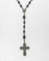 A simple, yet masculine addition to your ensemble, with a strand black onyx beads complemented by a sterling silver cross pendant.Sterling silverBlack onyxAbout 37, inner diam.About 7 dropImported