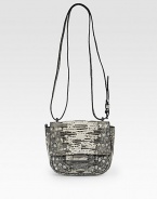 A compact shape of exotic Tejus lizard skin, blends artisan craftsmanship with a modern crossbody design.Adjustable crossbody strap, 23-27 drop Snap flap closure One outside zip pocket One inside zip pocket Two center compartments Leather lining 7W X 6H X 2½D Made in Italy