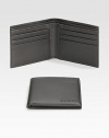 A classic leather bi-fold wallet with cut-out logo detail. Two bill compartments Six card slots 4.3W X 3.5H Made in Italy 