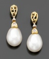 Cultured freshwater pearl (8-10 mm) earrings with pretty diamond accents provide an elegant accessory for the office or sophisticated style for evening wear. Set in 14k gold. Drop measures 3/4 inch.