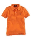 A short-sleeved polo shirt is cut in soft breathable cotton mesh.