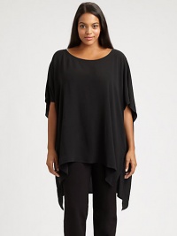 Made from luxurious silk, an ultra-feminine top with a fashion-forward uneven hem. Wear this top with slim pants for a so-right-now look.Round neckElbow-length sleevesPull-on styleAsymmetrical hemAbout 30 from shoulder to hemSilkDry cleanImported Made from luxurious silk, an ultra-feminine top with a fashion-forward uneven hem. Wear this top with slim pants for a so-right-now look.Round neckElbow-length sleevesPull-on styleAsymmetrical hemAbout 30 from shoulder to hemSilkDry cleanImported