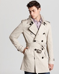 An undisputed classic from Burberry, the double-breasted trench coat brings understated style to blustery days. An undisputed classic from Burberry, the double-breasted trench coat brings understated style to blustery days.