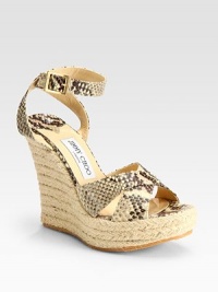Snake-embossed leather straps and an espadrille wedge says safari chic. Wedge heel, 5 (125mm) Platform, 1½ (40mm) Compares to a 3½ heel (90mm) Adjustable ankle strap Leather lining Rubber sole Made in ItalyOUR FIT MODEL RECOMMENDS ordering true whole size; ½ sizes should order the next whole size up. Snake-embossed leather straps and an espadrille wedge says safari chic. Wedge heel, 5 (125mm) Platform, 1½ (40mm) Compares to a 3½ heel (90mm) Adjustable ankle strap Leather lining Rubber sole Made in ItalyOUR FIT MODEL RECOMMENDS ordering true whole size; ½ sizes should order the next whole size up.