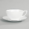 Jasper Conran continues to close the gap between formal dining and casual living. He accents the contemporary beauty of his already popular white bone china range with a touch of formality in the forum of a thin platinum band. To create an interplay of proportions, accent pieces including a plate, a charger, a small pitcher, mug, teacup and saucer, use thick platinum stripes to reinforce the pattern's look of sophisticated elegance.