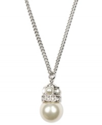 Simplicity and subtlety combine. This effortlessly gorgeous Givenchy necklace highlights a polished glass pearl (10 mm) and sparkling crystals set in silver tone mixed metal. Approximate length: 18 inches. Approximate drop: 1 inch. Simplicity and subtlety combine. This effortlessly gorgeous Givenchy necklace highlights a polished glass pearl (10 mm) and sparkling crystals set in silver tone mixed metal. Approximate length: 18 inches. Approximate drop: 1 inch.