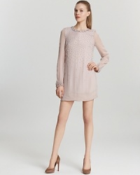 Sparkle in the limelight in a 1950's-inspired French Connection dress adorned with beading and sequins for stellar party style. Sheer sleeves add to the allure, while an abbreviated silhouette lends coquettish appeal. Sparkle in the limelight in a 1950's-inspired French Connection dress adorned with beading and sequins for stellar party style. Sheer sleeves add to the allure, while an abbreviated silhouette lends coquettish appeal.