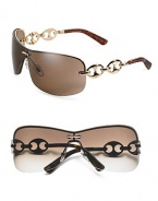 Rimless three-piece mount with marina chain temple. Available in gold frames with brown lens and chocolate frames with gray lens. Metal Made in Italy 