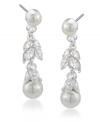 Feminine and fanciful. Add a ladylike look to your style with Carolee's floral linear drop earrings. Featuring luminous glass pearls and glittering glass accents, they're set in silver tone mixed metal. Approximate drop: 1-3/8 inches.
