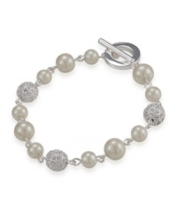 Add elegant inspiration with a sophisticated bracelet by Carolee. Crafted in mixed metal with toggle clasp, bracelet features glass pearls and crystal fireballs. Approximate length: 7-1/4 inches. Add elegant inspiration with a sophisticated bracelet by Carolee. Crafted in mixed metal with toggle clasp, bracelet features glass pearls and crystal fireballs. Approximate length: 7-1/4 inches.