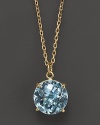 An elegant blue topaz pendant necklace in 18 Kt. yellow gold. With Roberto Coin's signature ruby accents.