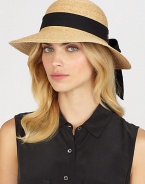 Fine braided raffia accented with polka dot ribbon trim can be worn with brim turned up or rolled down. Bow at back Adjustable sizing cord Brim, about 3½ Imported