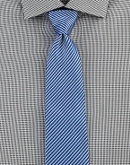 Bold stripes in oceanic hues define this timeless style of fine Italian cotton. CottonDry cleanMade in Italy
