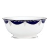 Embellished with raised enamel dots and finished with gleaming platinum, this grand serving bowl from Marchesa by Lenox brings the designer's opulently beaded bridal dresses to the world of fine dining.