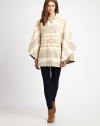 Inspired by Midwestern textiles, this slouchy poncho style will keep you cozy all season long.HoodDropped shouldersOpen sleevesConcealed button frontAbout 30 from shoulder to hem82% wool/18% cottonDry cleanMade in USAPlease note: one size fits all.This style runs true to size. We recommend ordering your usual size for a standard fit. 