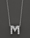 From the Tiny Treasures collection, a diamond M necklace. With signature ruby accent. Designed by Roberto Coin.
