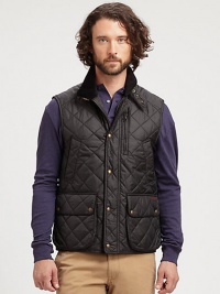A sporty quilted style with snap front and pockets that adds an additional layer of warmth.Corduroy collarZip front with snap storm placketBuckled tab at neckVertical pocketsBellows pockets with snap flapBack snap vents at hemNylon liningAbout 27 from shoulder to hemPolyesterDry cleanImported A sporty quilted style with snap front and pockets that adds an additional layer of warmth.Corduroy collarZip front with snap storm placketBuckled tab at neckVertical pocketsBellows pockets with snap flapBack snap vents at hemNylon liningAbout 27 from shoulder to hemPolyesterDry cleanImported