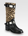 Lush pony hair takes on an exotic print in this leather staple with sleek metal accents and buckle straps. Stacked heel, 1¾ (45mm)Shaft, 11Leg circumference, 13½Leopard-print pony hair and leather upperPull-on style with adjustable buckle strapsLeather lining and solePadded insoleMade in Italy