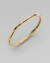 From the Martellato Collection. A luminous accent for the wrist is designed with the unique hammered look of 18k yellow gold. Chic to wear alone or doubled up with others. 18k yellow gold Diameter, about 3 Made in Italy 