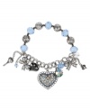 Winning charm. Betsey Johnson's pretty stretch bracelet combines bow and heart charms with blue faceted beads, clear and blue crystal accents, hematite-plating and key embellishments. Set in rhodium-plated mixed metal. Approximate length: 7-1/2 inches.