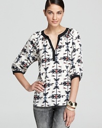 An Aqua henley shirt, designed with an exotic tribal print, is a sensation when paired with distressed jeans for new-season cool. An Aqua henley shirt, designed with an exotic tribal print, is a sensation when paired with distressed jeans for new-season cool.