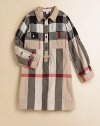 Fun smock styling in her favorite designer check.Pattern varies Spread collar Button placket Button flap chest pockets Side seam pockets Long sleeves with button tab roll cuffs Shirring below back shoulder yoke 97% cotton/2% nylon/1% elastane Machine wash Imported