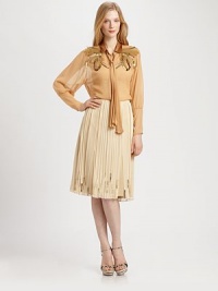 A brilliant silk blouse featuring light-reflecting pailettes and ultra-feminine sleeves.Tie-neck styleBlouson sleevesButton frontAbout 24 from shoulder to hemSilkDry cleanImported Model shown is 5'10½ (179cm) wearing US size Small. A brilliant silk blouse featuring light-reflecting pailettes and ultra-feminine sleeves.Tie-neck styleBlouson sleevesButton frontAbout 24 from shoulder to hemSilkDry cleanImported Model shown is 5'10½ (179cm) wearing US size Small.