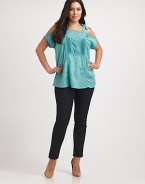 Show a little skin with this unique take on the classic peasant top. This cold-shoulder design features lovely eyelet and self-tie details. Square neckCold shouldersSelf-tiesEyelet and embroidered details at centerAbout 30 from shoulder to hemCottonMachine washImported