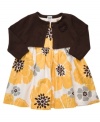 Put her in a new spin on floral with this neutral but lively dress and cardigan set from Carter's.