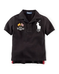 A preppy short-sleeved polo shirt in breathable cotton mesh is accented with country embroidery, celebrating Team USA's participation in the 2012 Olympics. A preppy short-sleeved polo shirt in breathable cotton mesh is accented with country embroidery, celebrating Team USA's participation in the 2012 Olympics.