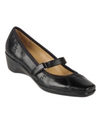 A stylish Mary Jane silhouette adds fashionable flair to Naturalizer's casual Lola wedges. A low heel, square-toe silhouette and adjustable velcro closure on the vamp provide plenty of comfort and support. A stylish Mary Jane silhouette adds fashionable flair to Naturalizer's casual Lola wedges. A low heel, square-toe silhouette and adjustable velcro closure on the vamp provide plenty of comfort and support.