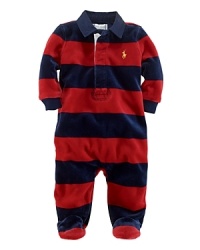 A comfortable footie in plush velour features a preppy rugby stripe and collar for a timeless sporty look. A comfortable footie in plush velour features a preppy rugby stripe and collar for a timeless sporty look.