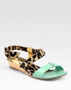 Lavish leopard-print calf hair surrounded by metallic leather and contrasting patent leather trim, finished with a natural wooden wedge. Wooden wedge, 1 (25mm)Patent leather, metallic leather and leopard-print calf hair upperPatent leather liningLeather soleImportedOUR FIT MODEL RECOMMENDS ordering true size. 