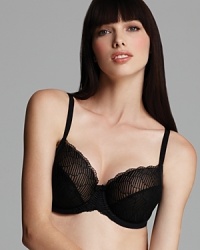 This full figure underwire bra from Wacoal features mesh patterned soft cups and scalloped lace trim detail for a feminine finish. Style #855117