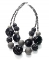Round up the usual suspects with this chic statement necklace from Stye&co. The circular plastic beads make this accessory your go-to finishing piece. Crafted in hematite tone mixed metal. Approximate length: 19 inches + 2-inch extender.