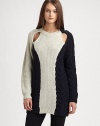 A modern and inventive take on the classic pullover, with unexpected shoulder cutouts, asymmetrical contrast panels and chunky cable-knit detailing.Ribbed crewneckLong sleeves with ribbed cuffsShoulder cutoutsContrast panelsRibbed hemAbout 31 from shoulder to hem66% wool/23% viscose/9% nylon/2% alpacaDry cleanImportedModel is 5'10 (177cm) wearing US size Small.OUR FIT MODEL RECOMMENDS ordering one size down as this style runs large. 