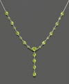 Shine bright with this gorgeous 14k white gold necklace featuring peridot (7-3/4 ct. t.w.) in round, heart and oval cuts. Approximate length: 17 inches. Approximate drop: 1-1/4 inch.