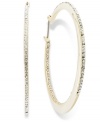 Hoop earrings get a sparkling infusion in this pair from Lauren by Ralph Lauren. Czech stones and gold-tone details add luster. Earrings feature a click-it closure. Approximate diameter: 2 inches. Approximate drop: 2 inches.